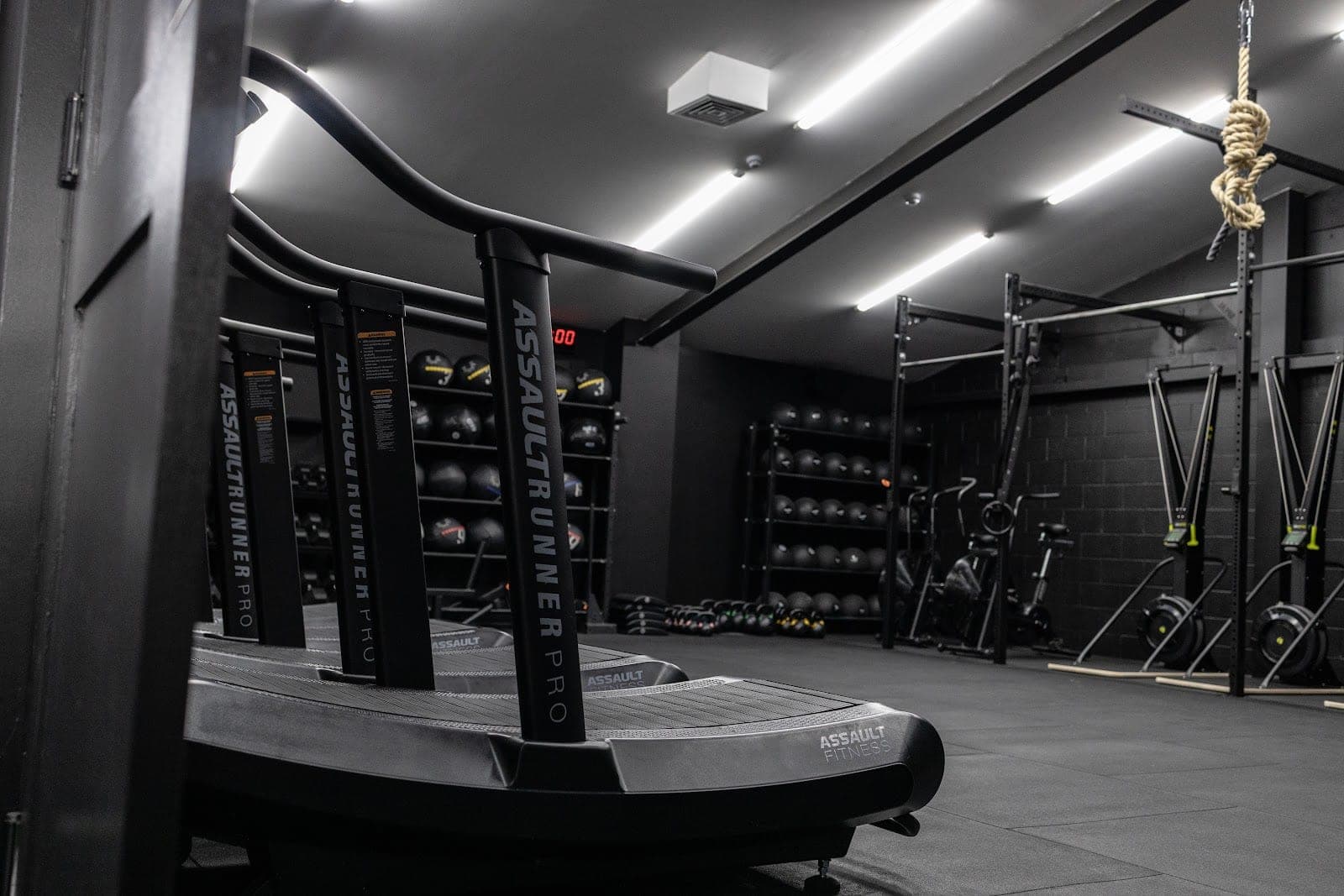 Assault Runner Pro curved treadmills lined up in the sweat room